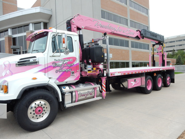 Gypsum Management & Supply Inc. bid $500,000, winning this breast cancer awareness-themed boom truck at auction. V&H Trucks Inc. put the truck up for auction and is donating the $205,000 profit from the sale to the Marshfield Clinic Research Foundation.