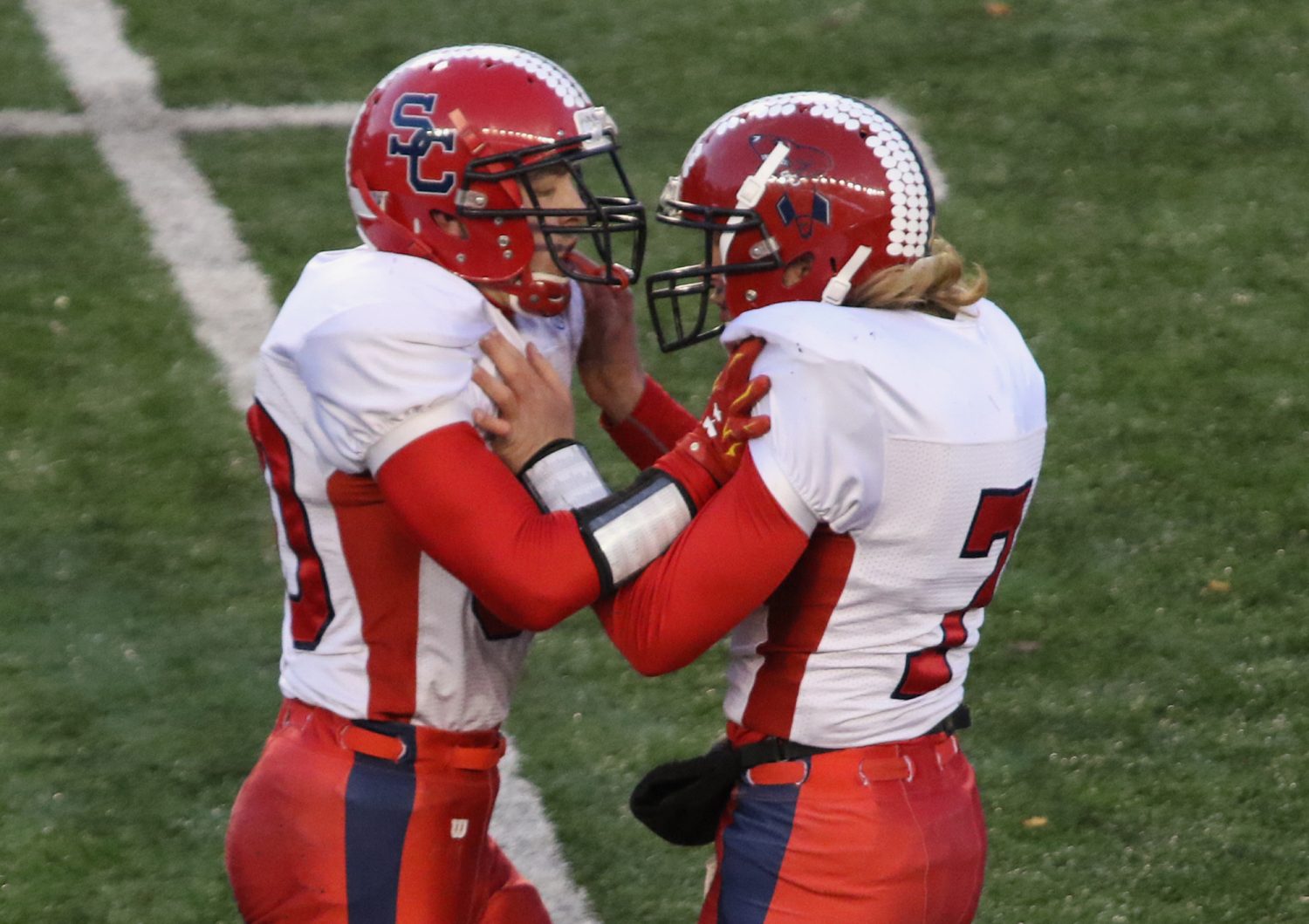 Spencer/Columbus' Ryan Busse, left, and Calvin Lenz celebrate a defensive play as the Rockets lost to Amherst 42-0 in the WIAA Division 5 State Championship Game at Camp Randall Stadium in Madison, Thursday, Nov. 19, 2015.