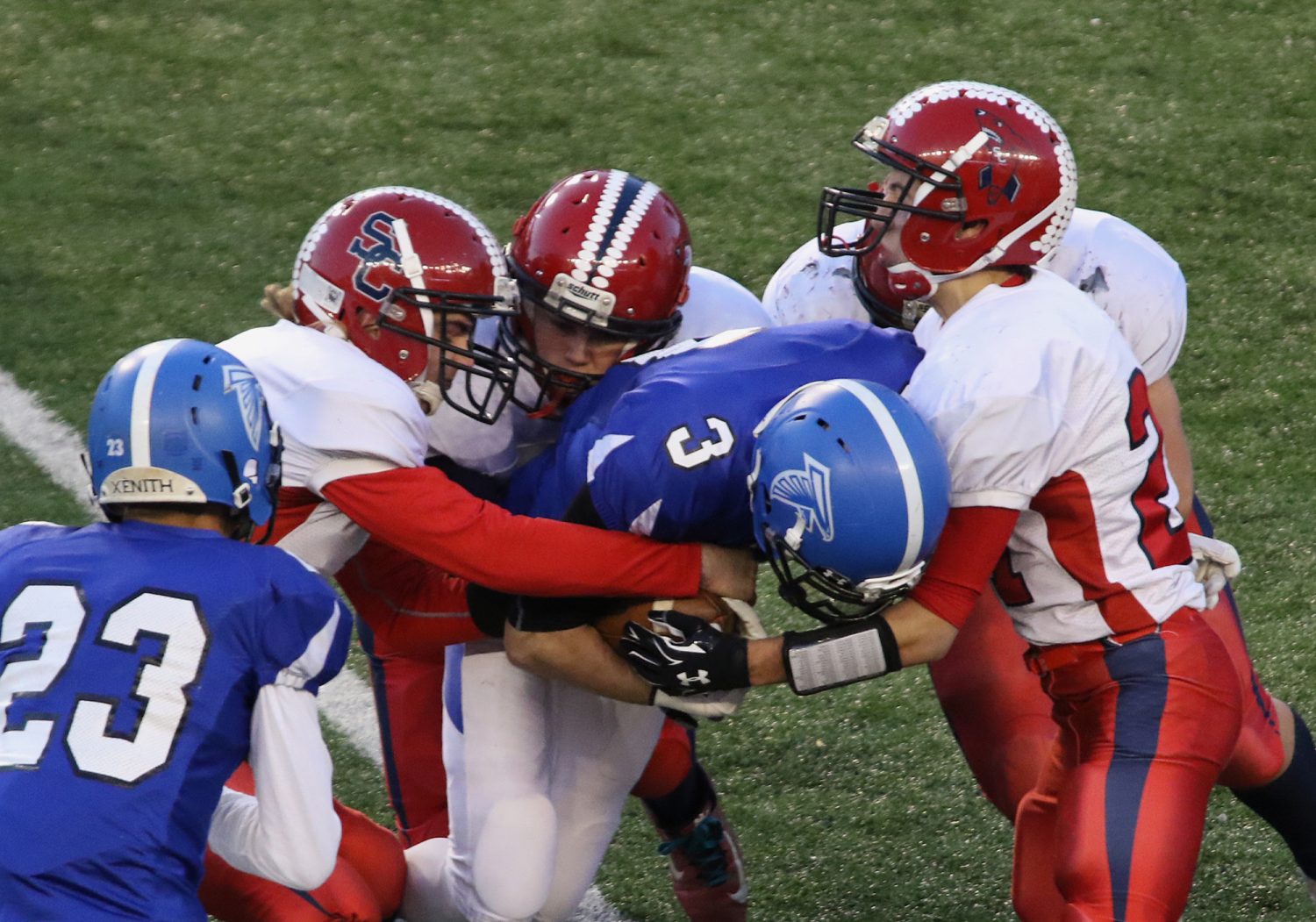 Spencer/Columbus defenders gang tackle Amherst’s Joshua Cisewski as the Rockets lost to Amherst 42-0 in the WIAA Division 5 State Championship Game at Camp Randall Stadium in Madison, Thursday, Nov. 19, 2015.