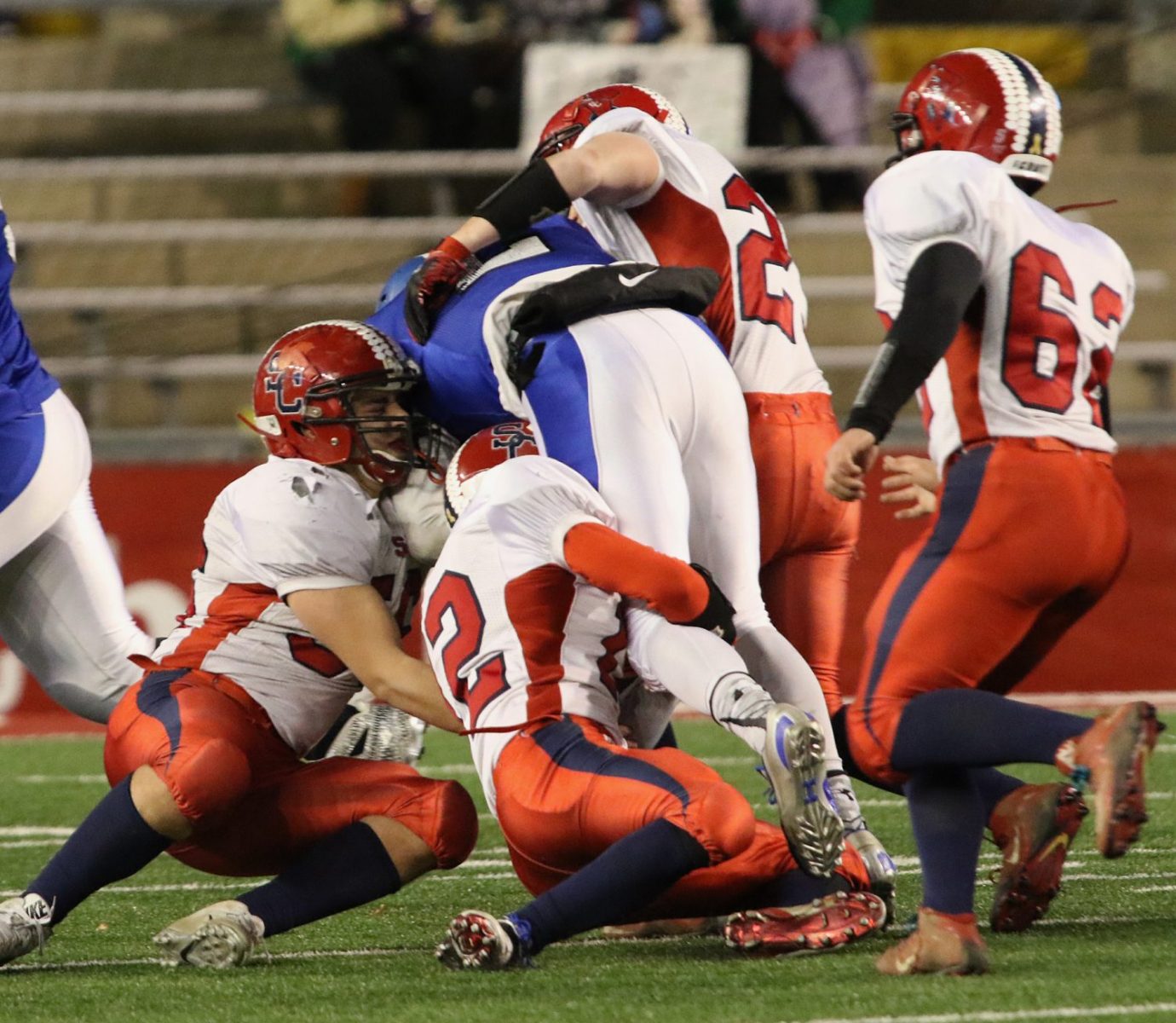 Spencer/Columbus defenders gang tackle an Amherst runner as the Rockets lost to Amherst 42-0 in the WIAA Division 5 State Championship Game at Camp Randall Stadium in Madison, Thursday, Nov. 19, 2015.