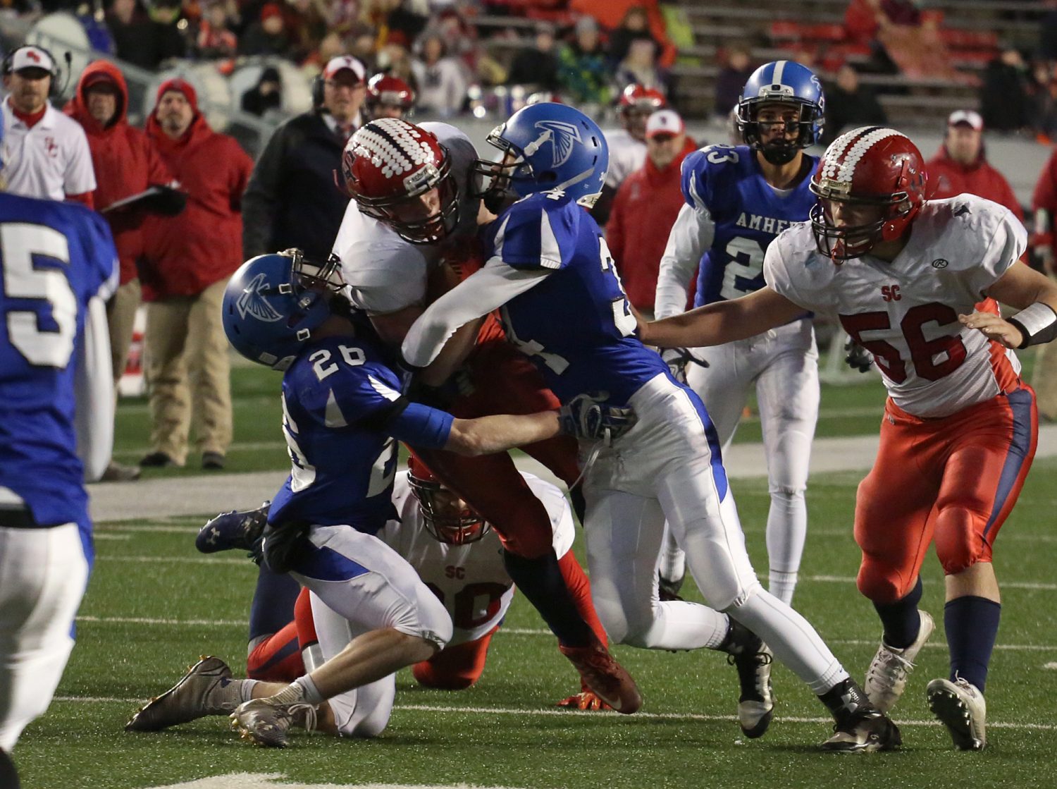 Spencer/Columbus' Hunter Hildebrandt is sandwiched between two Amherst defenders after catching a pass on a 3rd-and-goal play late in the first half as the Rockets lost to Amherst 42-0 in the WIAA Division 5 State Championship Game at Camp Randall Stadium in Madison, Thursday, Nov. 19, 2015.