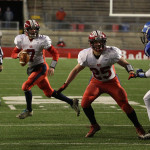 Spencer/Columbus quarterback Calvin Lenz rolls out on a 4th and goal play late in the first half as the Rockets lost to Amherst 42-0 in the WIAA Division 5 State Championship Game at Camp Randall Stadium in Madison, Thursday, Nov. 19, 2015. Lenz threw a desperation pass that was intercepted.