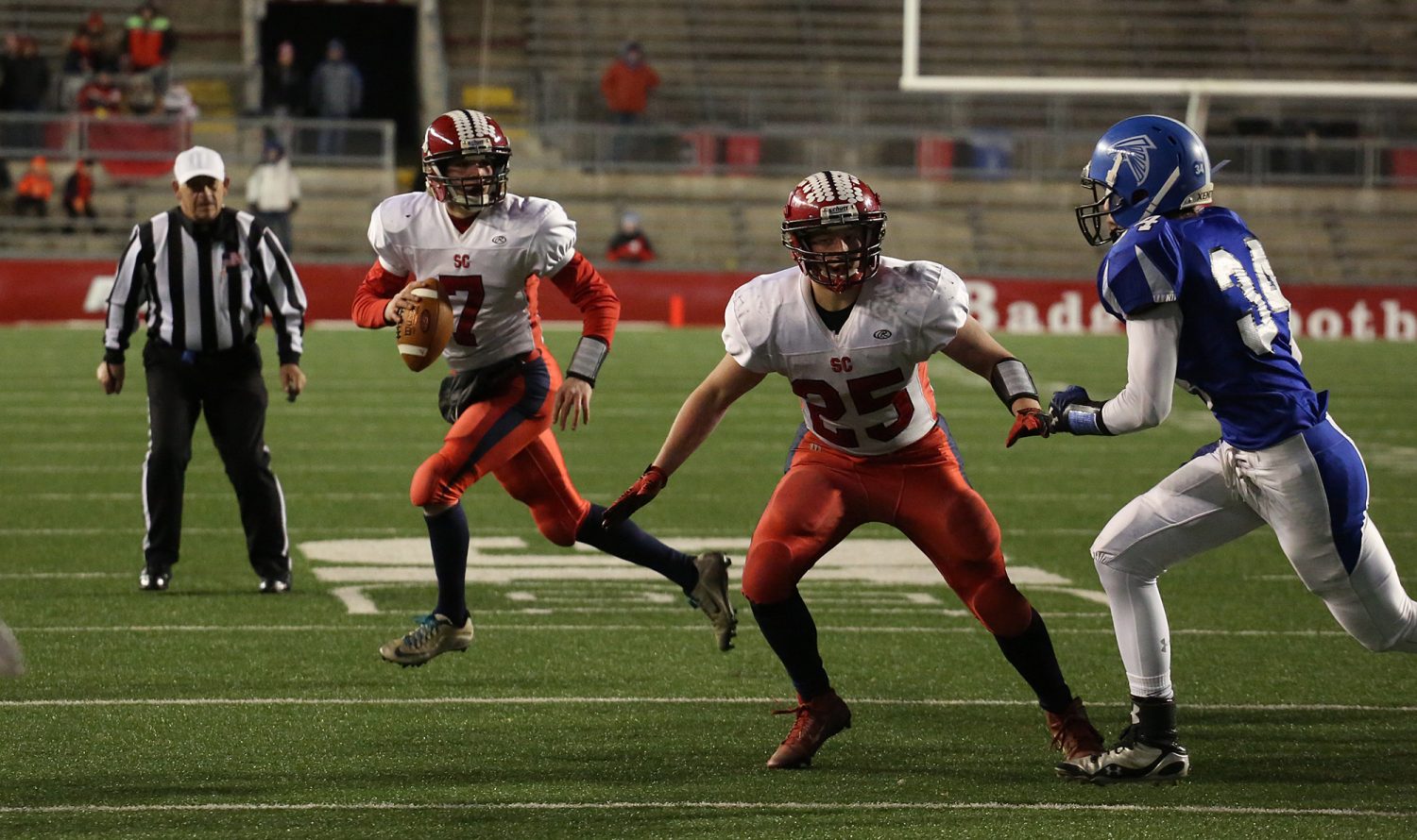 Spencer/Columbus quarterback Calvin Lenz rolls out on a 4th and goal play late in the first half as the Rockets lost to Amherst 42-0 in the WIAA Division 5 State Championship Game at Camp Randall Stadium in Madison, Thursday, Nov. 19, 2015. Lenz threw a desperation pass that was intercepted.