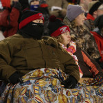 Joel Cieslinski and his wife Melissa of Spencer are bundled up against the cold as the Rockets lost to Amherst 42-0 in the WIAA Division 5 State Championship Game at Camp Randall Stadium in Madison, Thursday, Nov. 19, 2015.