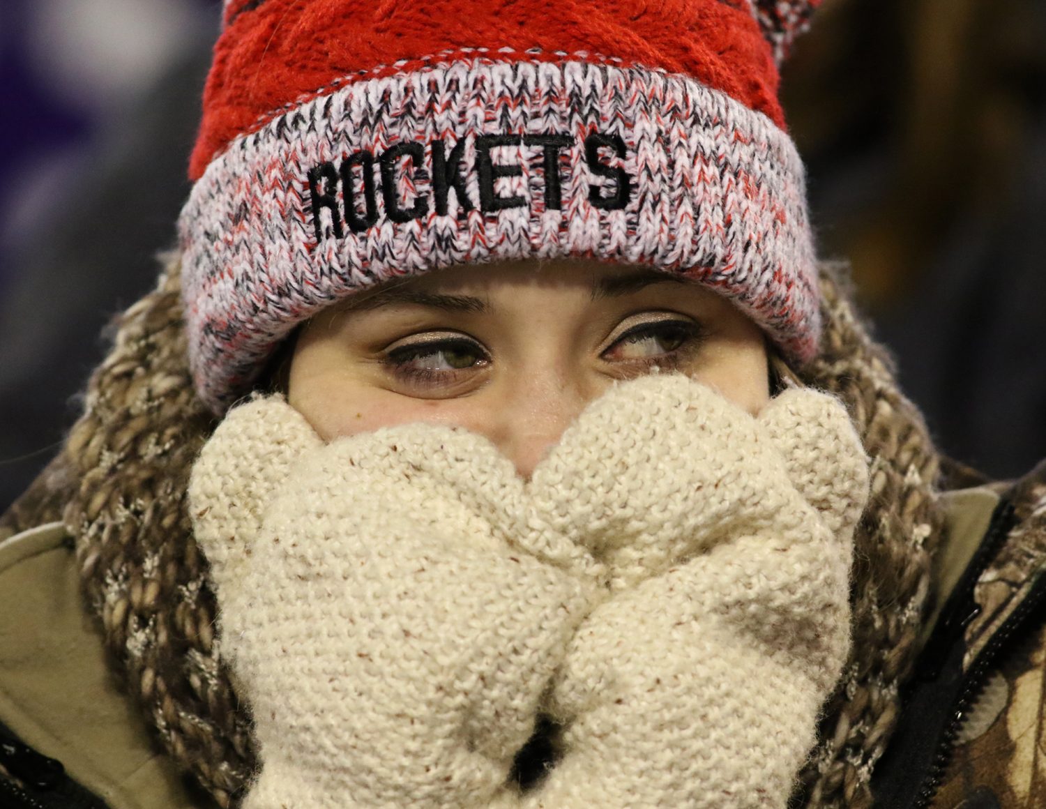 Disappointed Spencer 10th grader Sadie Mercier covers much of her face as she watches action in the third quarter as the Rockets lost to Amherst, 42-0, in the WIAA division 5 state championship game at Camp Randall Stadium in Madison, Thursday, November 19, 2015.