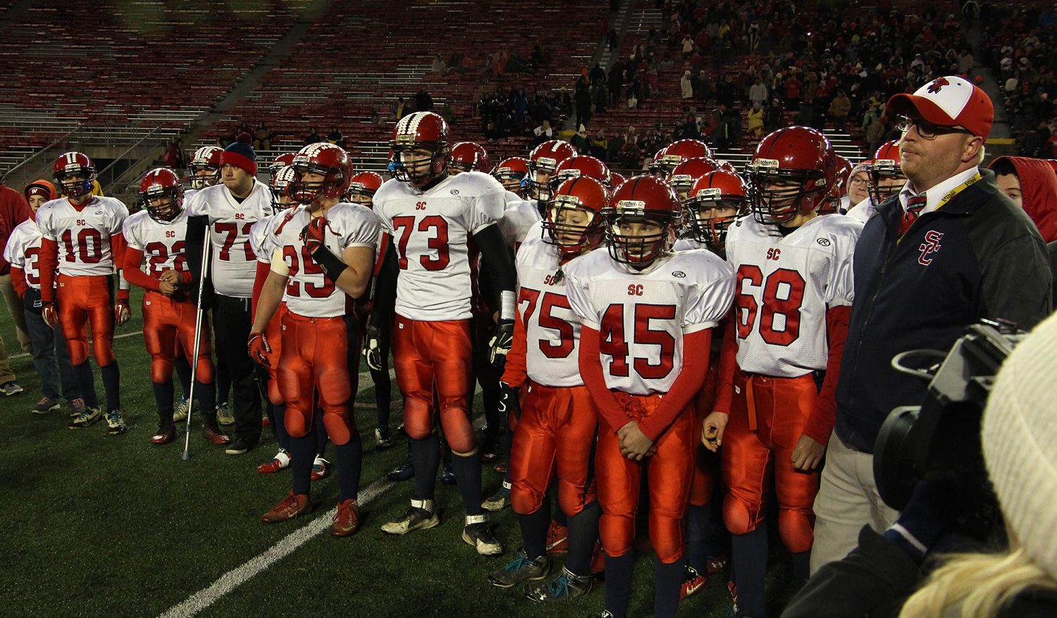 A disappointed Spencer/Columbus team waits to get its second place trophy after the Rockets lost to Amherst 42-0 in the WIAA Division 5 State Championship Game at Camp Randall Stadium in Madison, Thursday, Nov. 19, 2015.