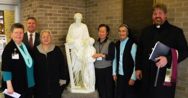 Participating in the blessing of the newly dedicated statue in the hospital main entrance were — left to right — Sister Lois Bush, senior advisor to the president and chief executive officer of Ministry Health Care and representative of the Sisters of the Sorrowful Mother Leadership Team; Brian Kief, Ministry Saint Joseph’s Hospital president; Sister Rita Adlkofer; Sister Mary Shin; Sister Barbara Hollweck; and the Rev. Eric Berns from Our Lady of Peace Catholic Church in Marshfield.