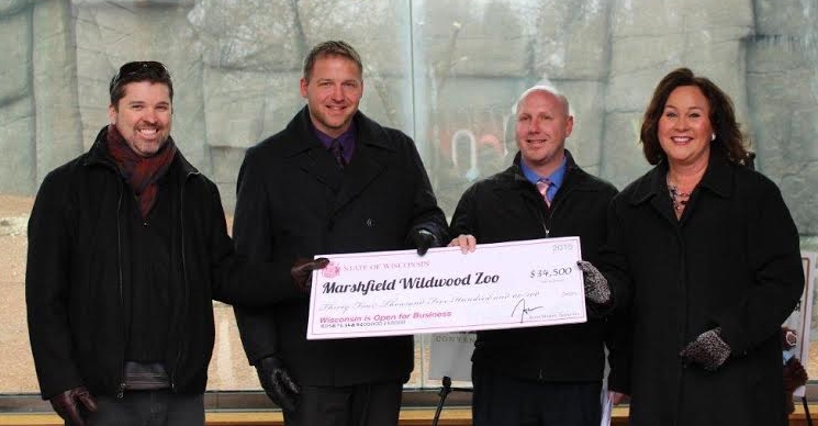 The Marshfield Convention and Visitors Bureau was recently awarded a $34,500 grant from the Wisconsin Department of Tourism to expand promotional efforts for Wildwood Zoo’s J.P. Adler Family Kodiak Bear Exhibit. Pictured left to right are Marshfield Convention and Visitors Bureau Director Matt McLean, Mayor Chris Meyer, Parks & Recreation Director Justin Casperson, and State Tourism Secretary Stephanie Klett.