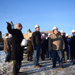 Community leaders and contributors to the campaign for a new public library gather on Tuesday, Jan. 4, to sign a beam before it is put in place on the new Everett Roehl Marshfield Public Library.
