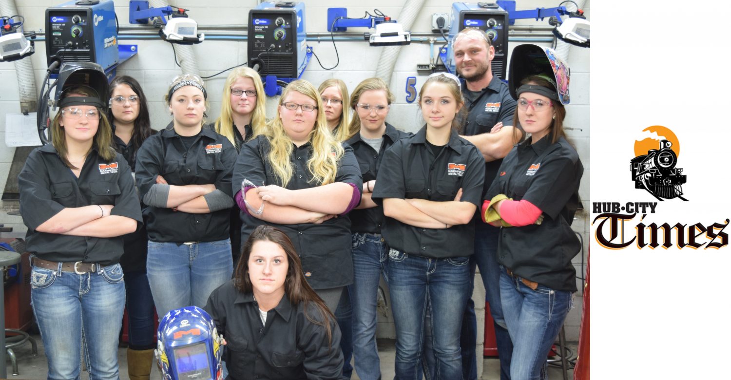Shown are the girls currently enrolled in metal tech courses at Marshfield High School. Kneeling in front: Megan Schultz. Front row from left: Erika Jacobs, Breanna Peskie, Alysha Bauer, Cassie Nieman, Allie Eckes. Back row from left: Kylee Stofferahn, Shantel Manthe, Mariah Luedtke, Hannah Ussery, instructor Ben Will.