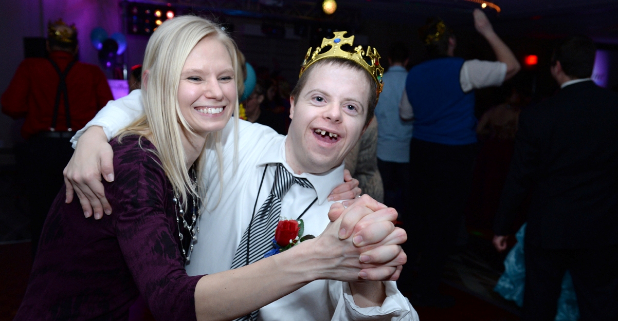 Ryan Lee dances with his personal caregiver and guest buddy Candace Corbin at the Marshfield Night to Shine prom.