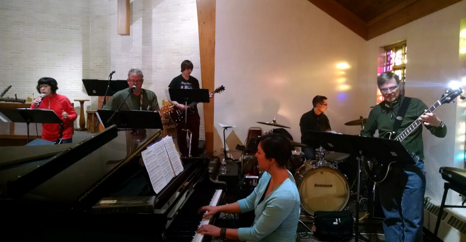 Members of Faith Fire practice for an upcoming benefit concert for the Frederic Ozanam Transitional Shelter. From left to right: Sue Jansen, Kurt Dovenbarger, Matt Nielsen, Beth Behnke-Seper, Dave Smith, and Randy Lueth.