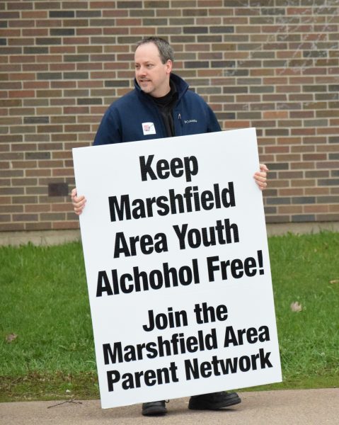 Lt. Pat Zeps of the Marshfield Police Department joined the human billboard on Friday, April 22.