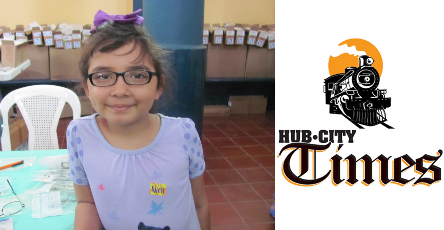 A young girl from Granada showcases her newly acquired eyeglasses courtesy of the Lions Club.