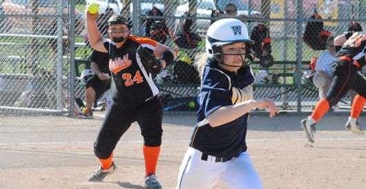 Marshfield pitcher Kaitlyn Konrardy tries to throw out Wausau West’s Sami Brown during the first inning of the Tigers’ 14-4 girls high school softball win over the Warriors Friday at the Marshfield Fairgrounds.
