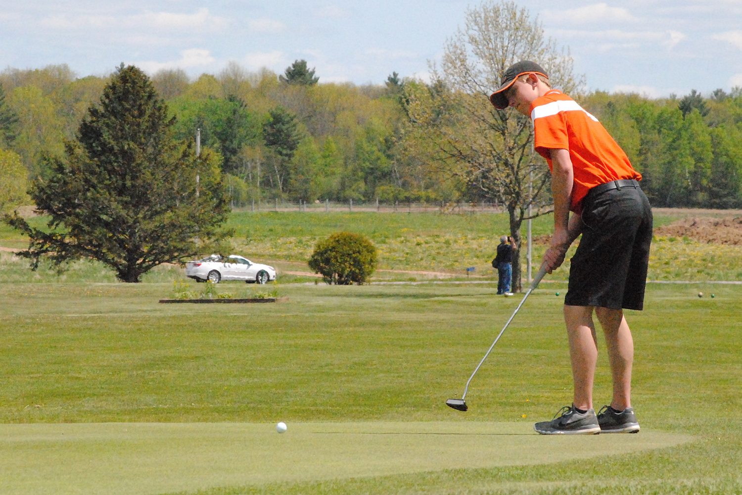 Marshfield’s Zach Hanson hits a putt on the par-3 fifth hole during the Wisconsin Valley Conference Boys Golf Meet on Tuesday at RiverEdge Golf Course in Marshfield. The Tigers finished fourth.
