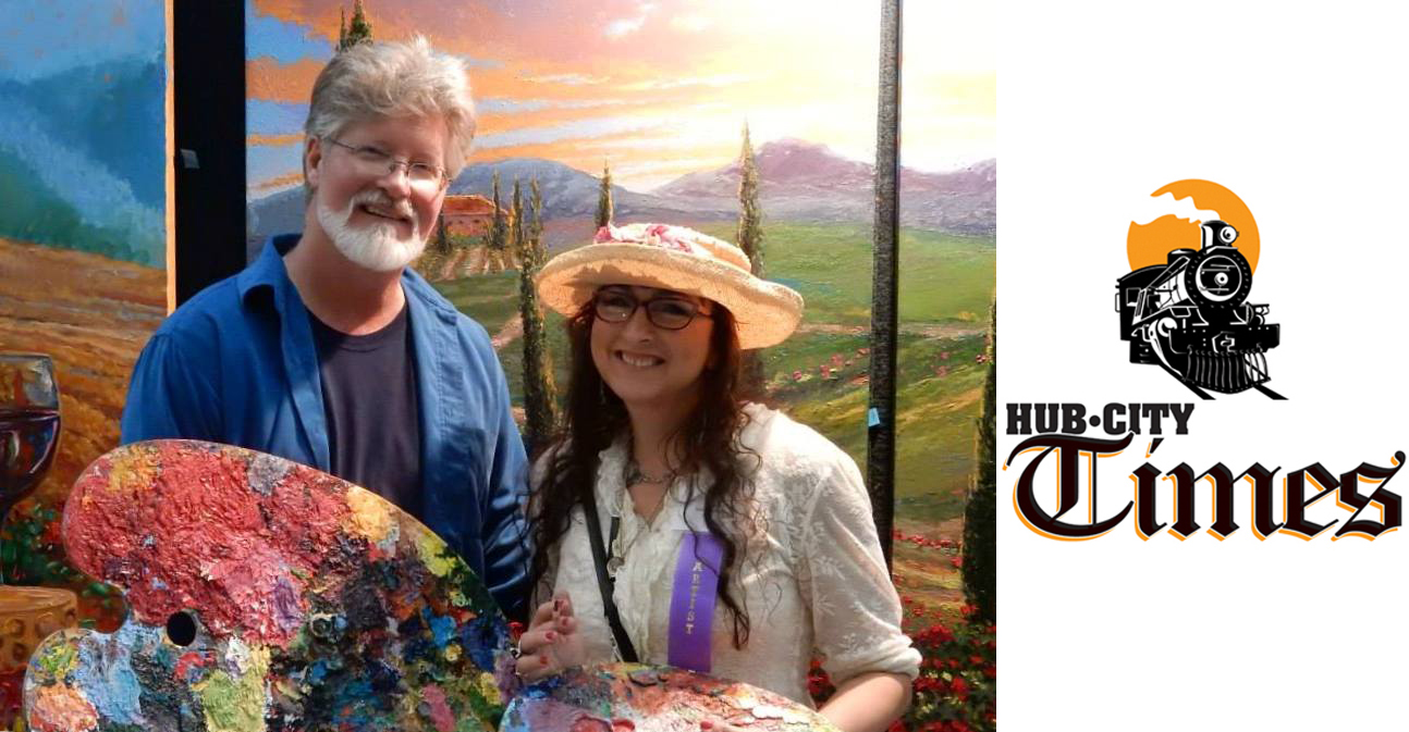 Kevin Miles and Wendy Schaefer-Miles stand in front of their paintings, which they collaborate to complete, at last year's Mother's Day Art Fair.