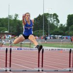 Sylviann Momont leaps over the final hurdle of the 300-meter hurdle race at the 2016 WIAA State Track & Field Championships at the University of La Crosse on June 3. She failed to move on as she was 14th in 49.62.