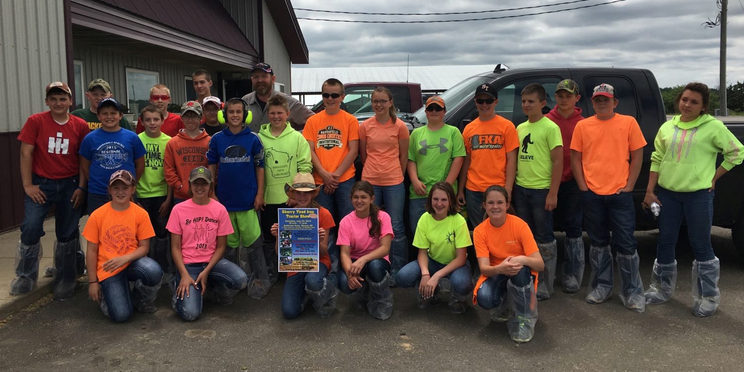 Auburndale tractor safety students pose for a photo at Liquid Coin Dairy in Milladore. Funds raised at the Sherry Tired Iron Tractor Show help defray the costs local students incur taking tractor safety courses.