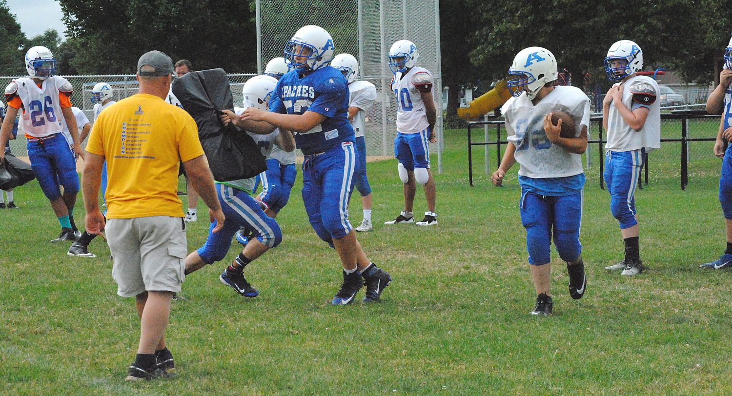 Members of the Auburndale football team take part in drills during a preseason practice last August. The Apaches, along with all high school football teams in the state, open camp on Tuesday.