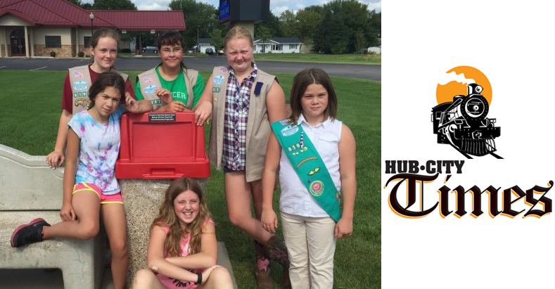Junior Girl Scouts from Troop 6197 in Spencer (back row from left) Elisha Blanchard, Arianna Likes, Samantha Soback, (front row from left) Alyson Brinker, Kaelyn Schreiner, and Emily Justman pose next to a trash can for which they raised funds. Troop member Samantha Budtke is not pictured.