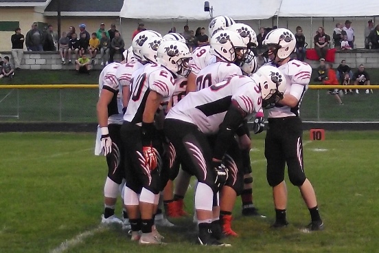 Stratford’s offense huddles up early in the game at Edgar on Friday night. The Tigers won 7-6 to improve to 3-0 in the Marawood Conference.