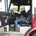 Erin Rickinger takes a look around the Marshfield Fire Department’s fire engine. Hub City Times Staff photo.
