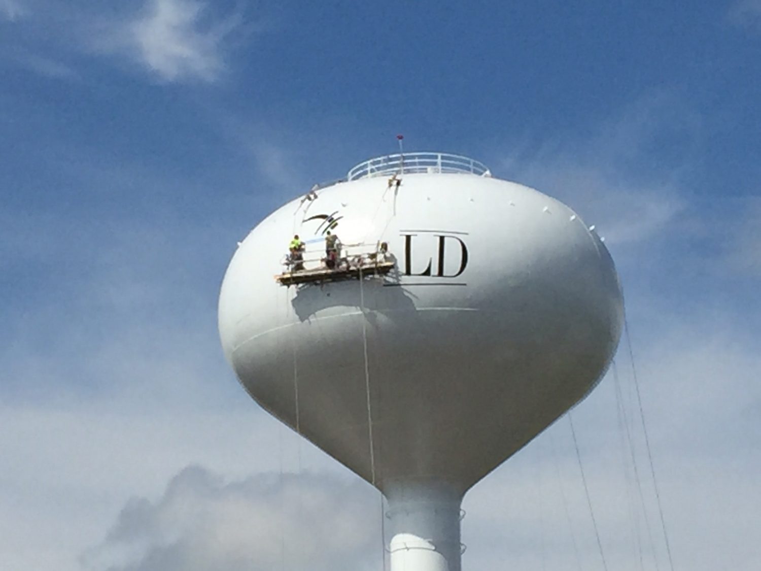 A crew repaints the Grant Park water tower earlier this year.