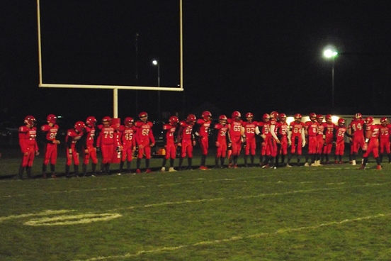 The Spencer/Columbus football team lines up for introductions prior to its game against Bonduel on Friday night at Spencer High School.