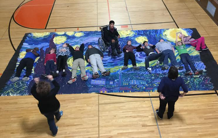 Co-Operative Art students get a sense of the scale of Van Gogh's "Starry Night."