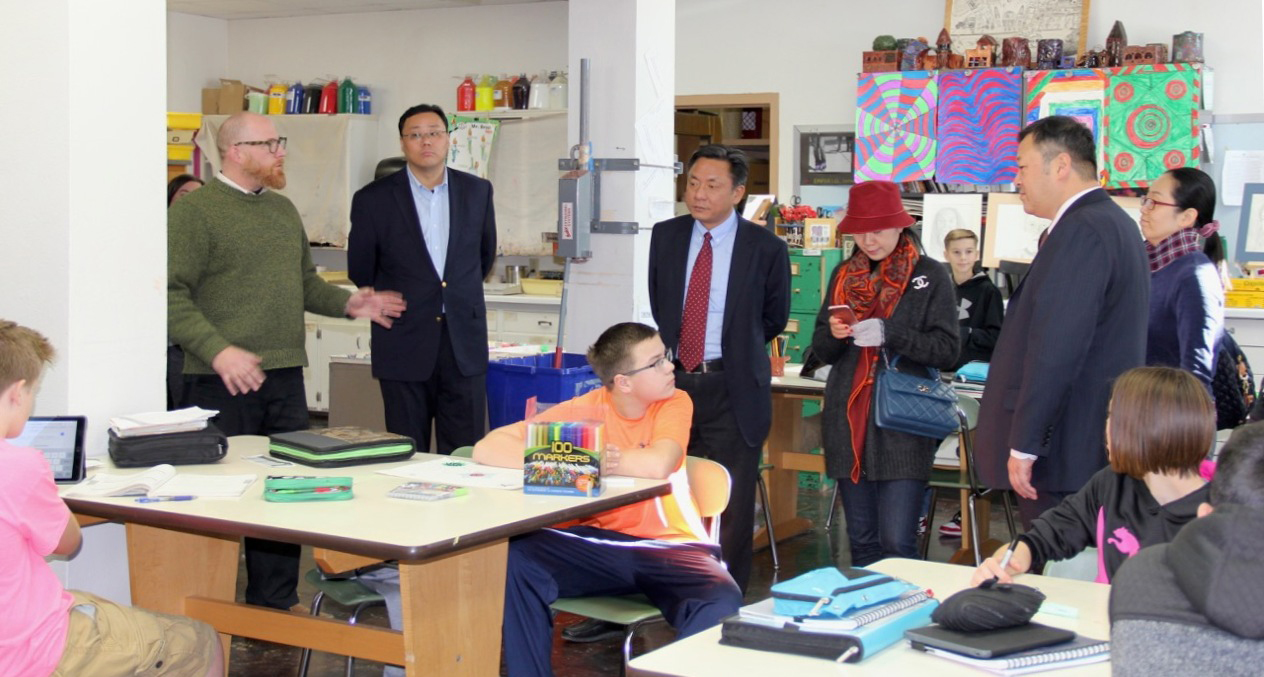 Chinese delegates observe teacher Eric Nelson's art class at Marshfield Middle School.