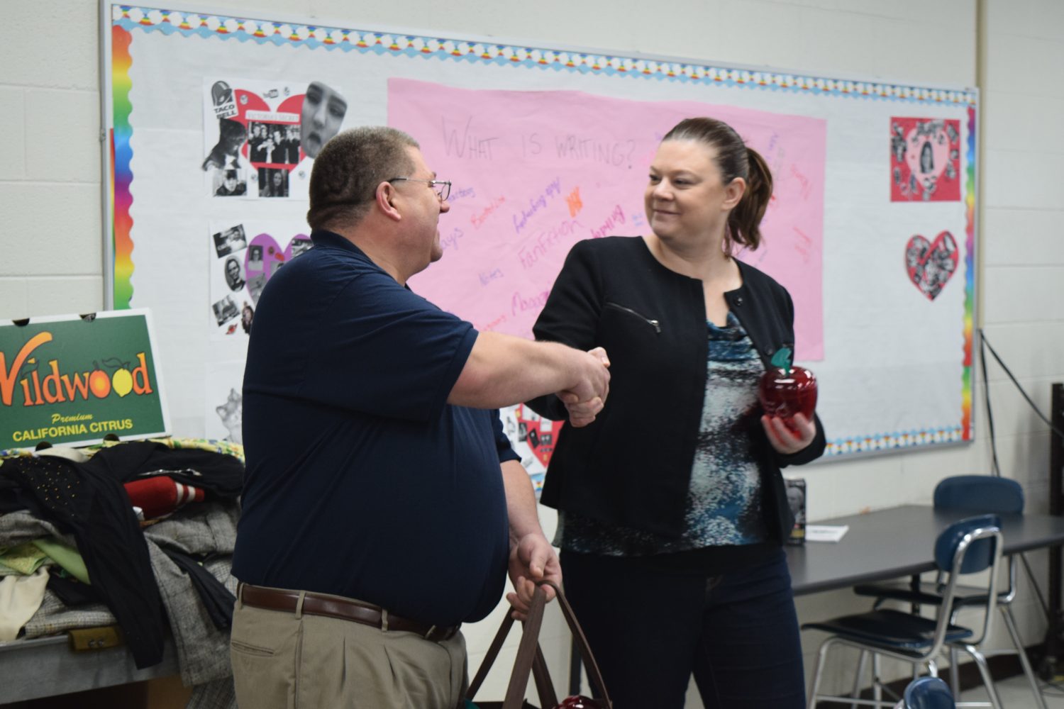 Harley Meyer thanks Spencer teacher Kristin Lohrentz for her commitment to local education.