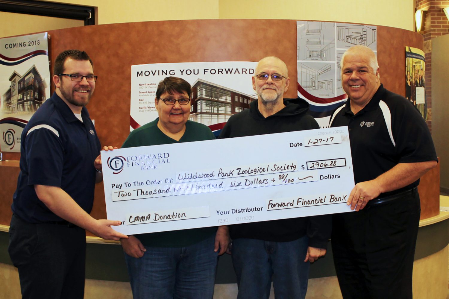 Personal Banker Chris Damerell (far left) and Mortgage Lender Bob McManus (far right) present a check from Forward Financial Bank to the Wildwood Zoological Society, represented by Mary Wilson and Tom Buttke.