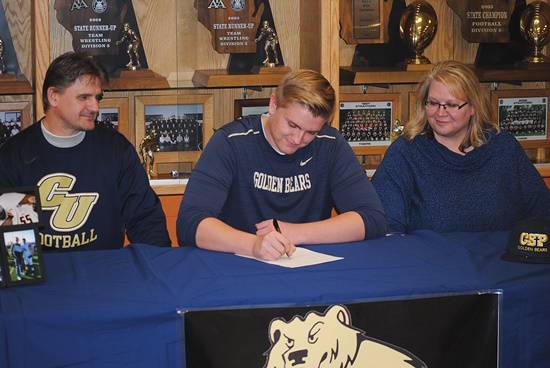 Stratford High School senior Tyson Kauffman signed a letter of intent to play college football at NCAA Division II school Concordia University in St. Paul, Minnesota, on Wednesday during a ceremony honoring three Tigers that signed their letters to play in the Northern Sun Intercollege Conference. Kauffman is flanked by his parents Jerome Kauffman and Betsy Miller.