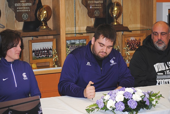 Stratford High School senior Tanner Weinfurtner signed a letter of intent to play college football at NCAA Division II school Winona State University in Minnesota on Wednesday during a ceremony honoring three Tigers that signed their letters to play in the Northern Sun Intercollege Conference. Weinfurtner is joined by his parents Lisa and Kurt Weinfurtner.