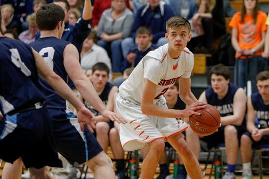 Stratford’s Vaughn Breit eyes the Manitowoc Roncalli defense during the WIAA Division 4 boys basketball sectional final Saturday at Waupaca High School.