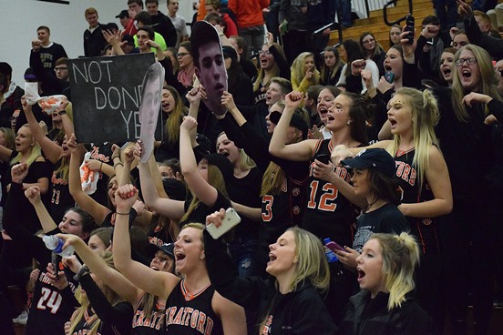 The Stratford student section sings the school song after the Tigers’ victory over Neillsville in a WIAA Division 4 boys basketball sectional semifinal Thursday at D.C. Everest High School in Schofield.