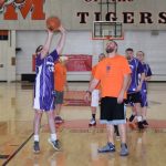 Richard Green, left, attempts to score a basket for the Special Olympics team.