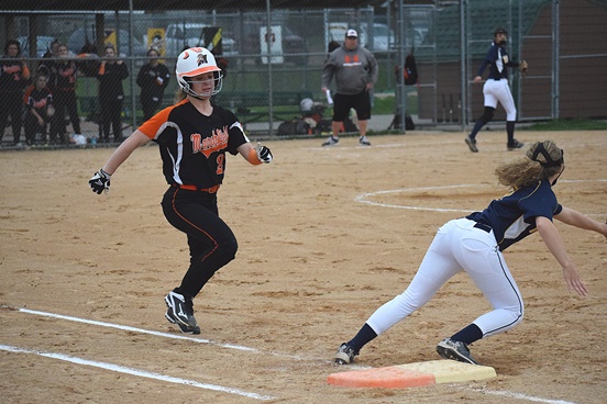 Marshfield’s Morgan Nordbeck legs out a bunt during the first inning of the Tigers’ win over Wausau West on Tuesday at the Marshfield Fairgrounds.
