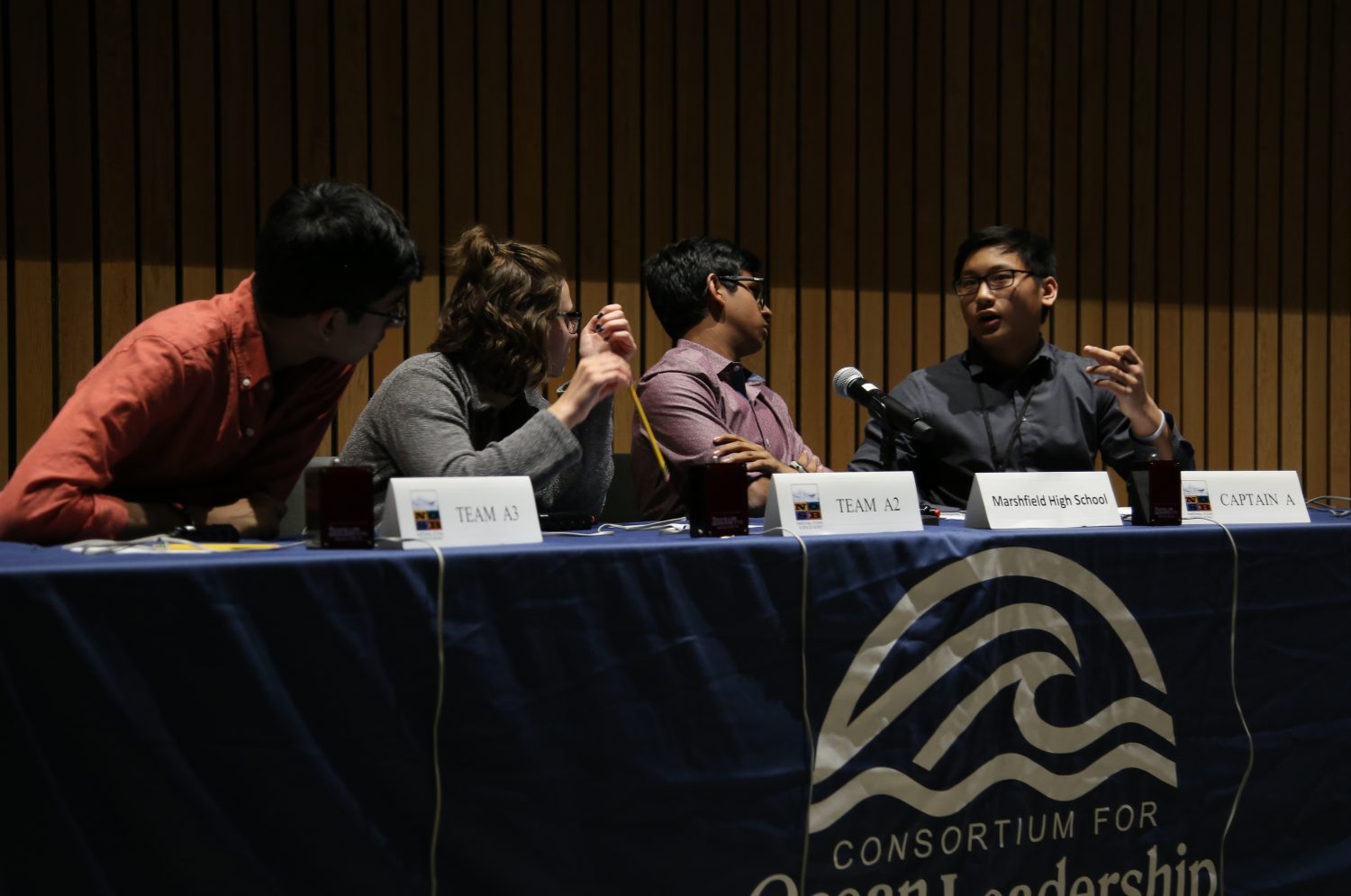 From left: Marshfield High School's Muhammad Abidi, Emma Raasch, Suhaas Bhat, and David Gui discuss an answer at the National Ocean Sciences Bowl national final on April 23.
