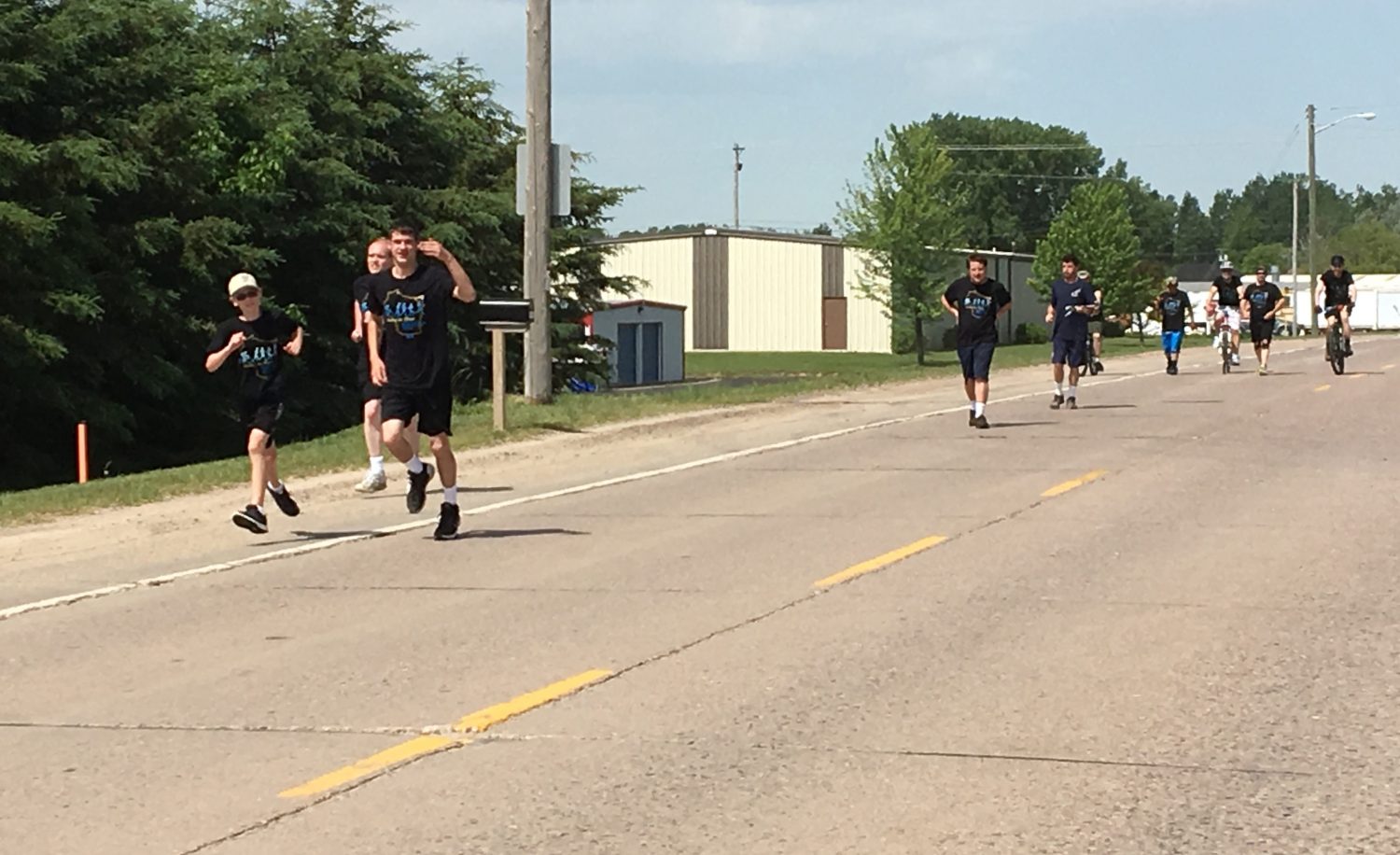 Members of the Marshfield Police Department and Special Olympics athletes participate in the Region 2 leg of the Special Olympics Summer Games Torch Run on June 8.