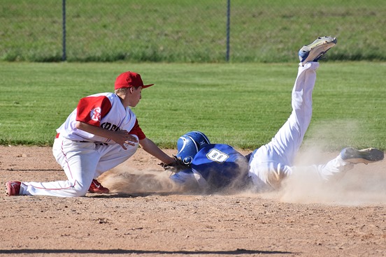 Spencer second baseman Brett Kasch tags out Auburndale’s Logan Willfahrt trying to steal during the second inning of the Rockets’ win in a WIAA Division 3 baseball regional final Wednesday at Auburndale High School.