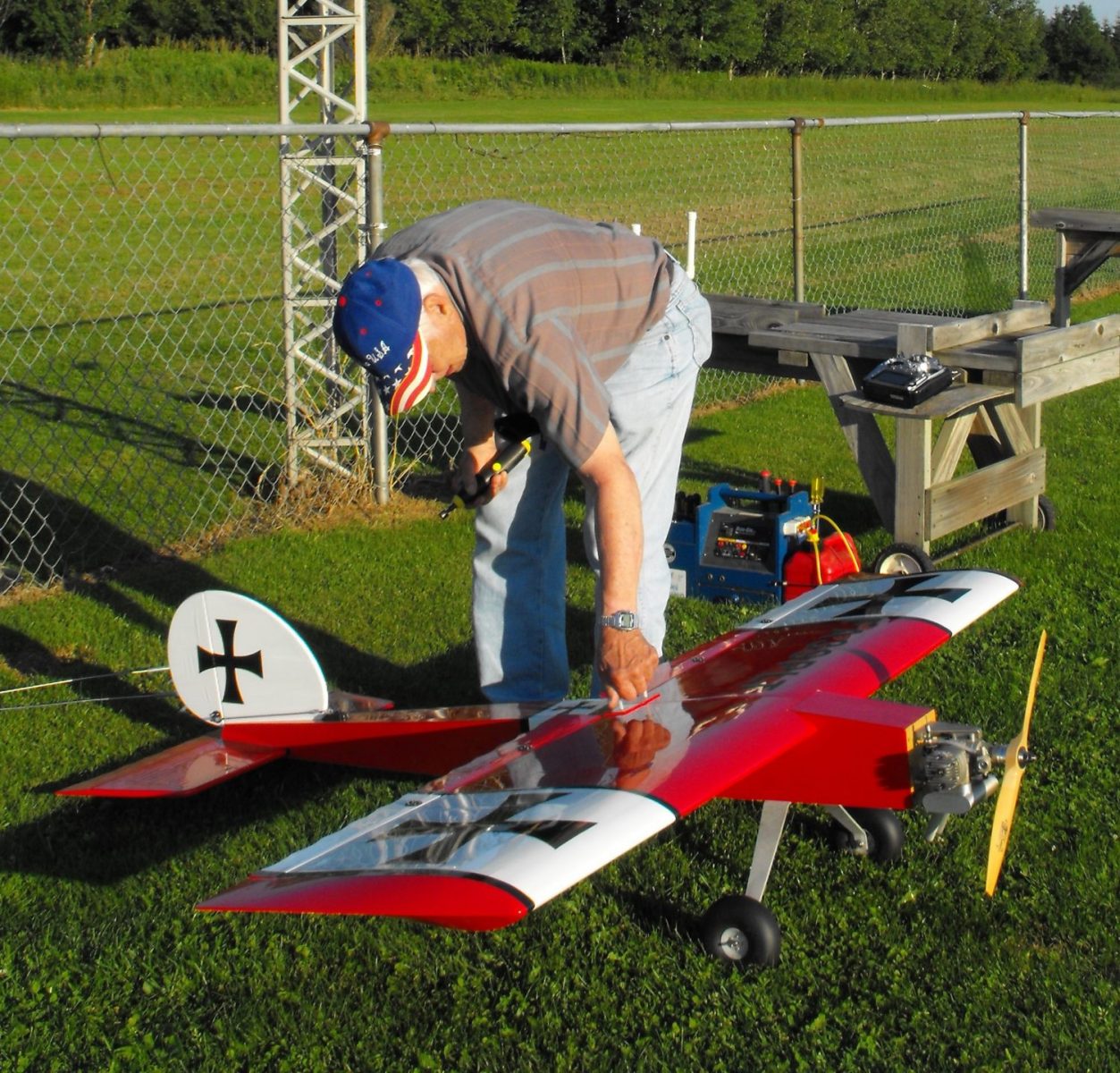 Mid State Aeroguidance Club member Burt Wells prepares to fly one of the gas-powered model planes that he has built.