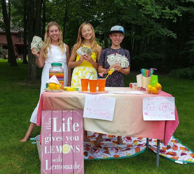 From left: Ava Hasenbank, Samantha Ridgway, and Cash Hasenbank raised funds for the Marshfield Area Pet Shelter, quenching golfers’ thirst with a lemonade stand at RiverEdge Golf Course on Aug. 9. The group said it had raised nearly $200.
