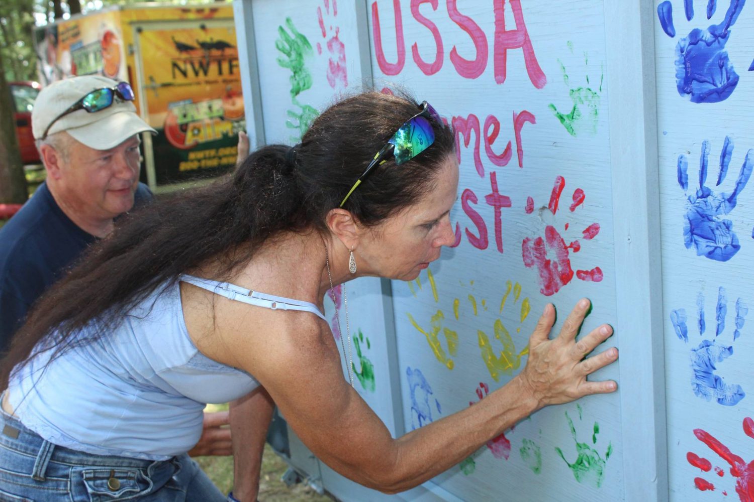 USSA founder Brigid ODonoghue leaves a painted handprint during the 2017 Summerfest event.