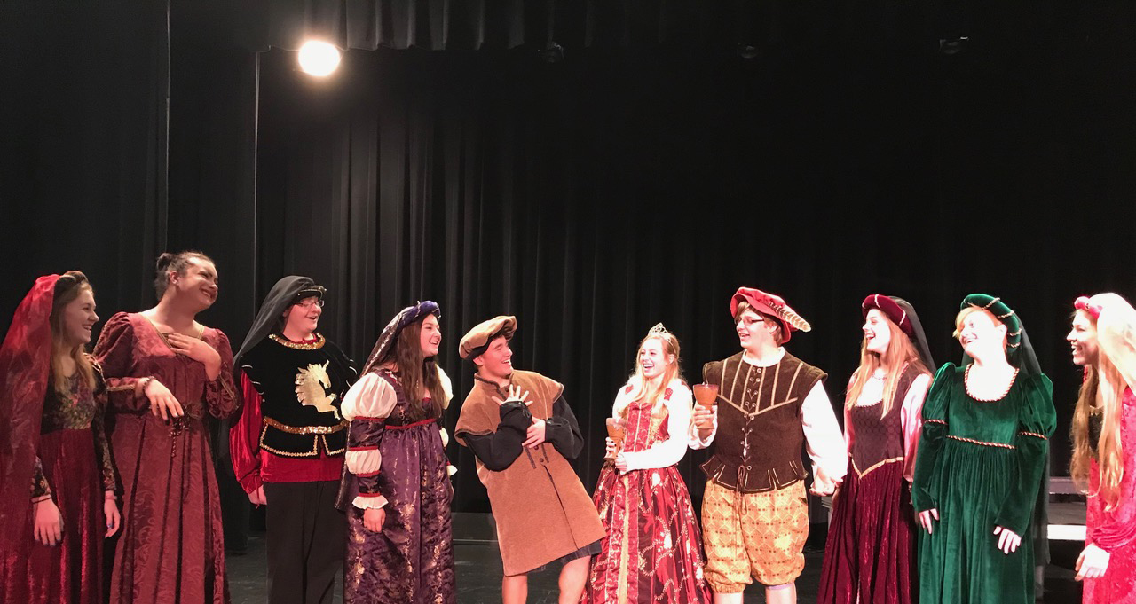 From left: Spencer's Oriana Madrigal Singers Jeaurdyn Czaikowski, Devin Gerstner, Brody Much, Caroline Riordan, Daniel Clark, Kaelyn Lyon, Zachary Dunbar, Shaelee Neitzel, Maggie Riordan, and Brianna Fredrickson share a chuckle as they rehearse for their upcoming Elizabethan Christmas Dinners. Not pictured are Madrigals Will Johnson and Sydney Johnson.