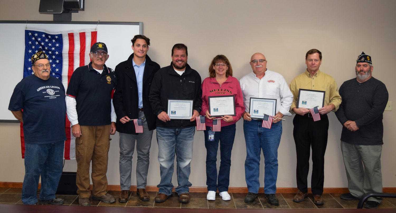 An awards ceremony was held at Nasonville Dairy on Oct. 31 to recognize dairies that had donated to Camp American Legion. Pictured, from left, are Russ LaMarche and Jim Kitchen, representing the American Legion; Westin and Tayt Wuethrich, Grassland Dairy; Cheryl Moeser, Mullins Cheese; Ken Heiman, Nasonville Dairy; Bill Schwantes, Lynn Dairy; and Clark County American Legion Commander Jim “Chip” Chadwick.