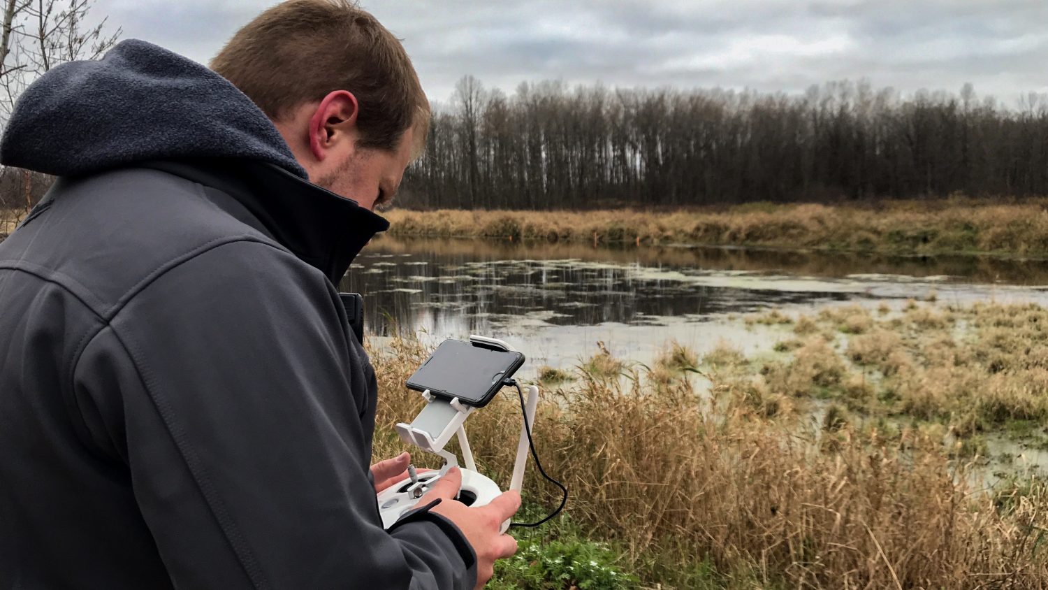 Branden Bodendorfer conducts a drone sweep during a search and rescue mission in the McMillan Marsh.