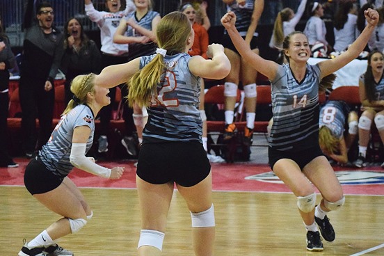 From left: Madisyn Daul, Brooke Peterson, and Mazie Nagel yell after Stratford clinched the first set of its Division 3 semifinal on Friday at the WIAA State Girls Volleyball Tournament at Resch Center in Green Bay. Regis went on to win the match 3-2.