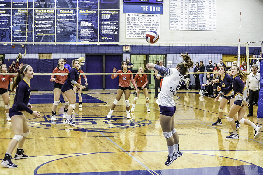 Libero Sydney Litwaitis returns a serve.